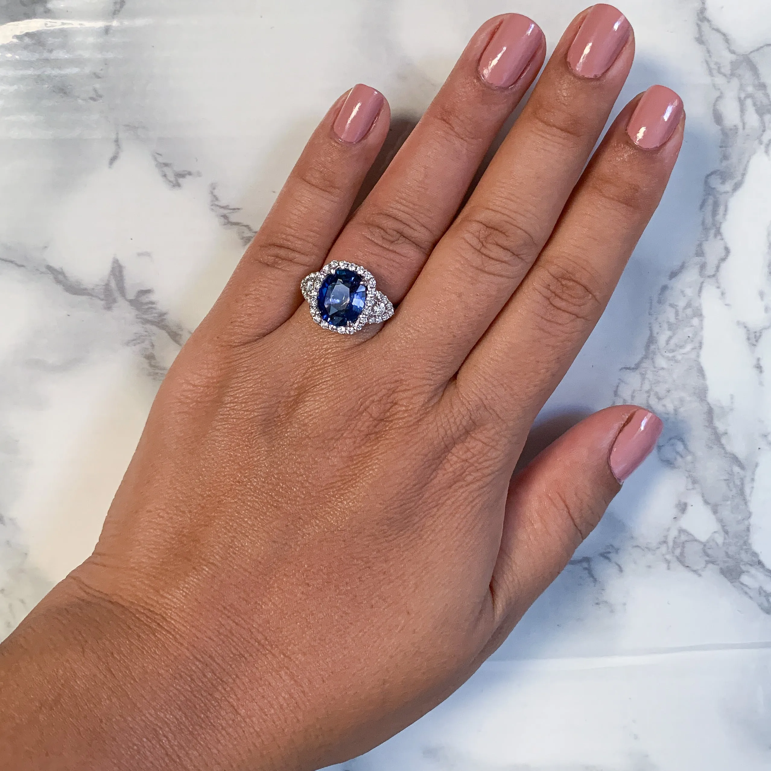 4.19ct Oval Blue Sapphire Ring with Diamond Halo in 18K White Gold