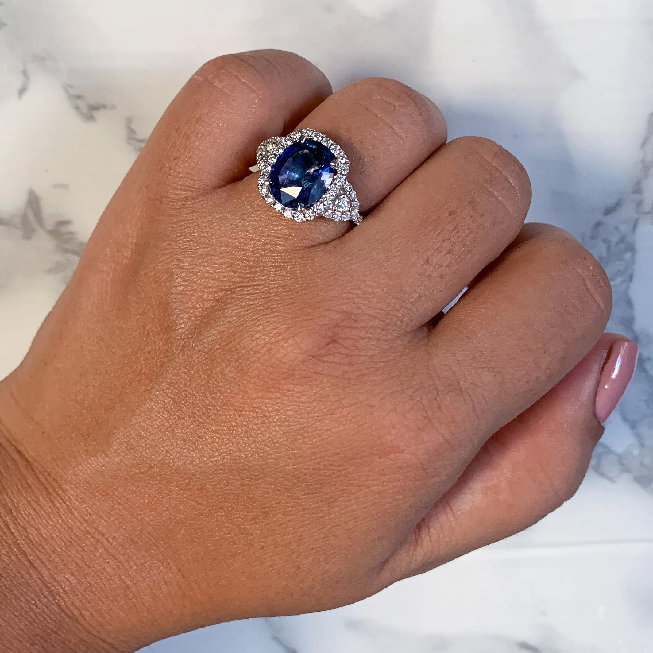 4.19ct Oval Blue Sapphire Ring with Diamond Halo in 18K White Gold