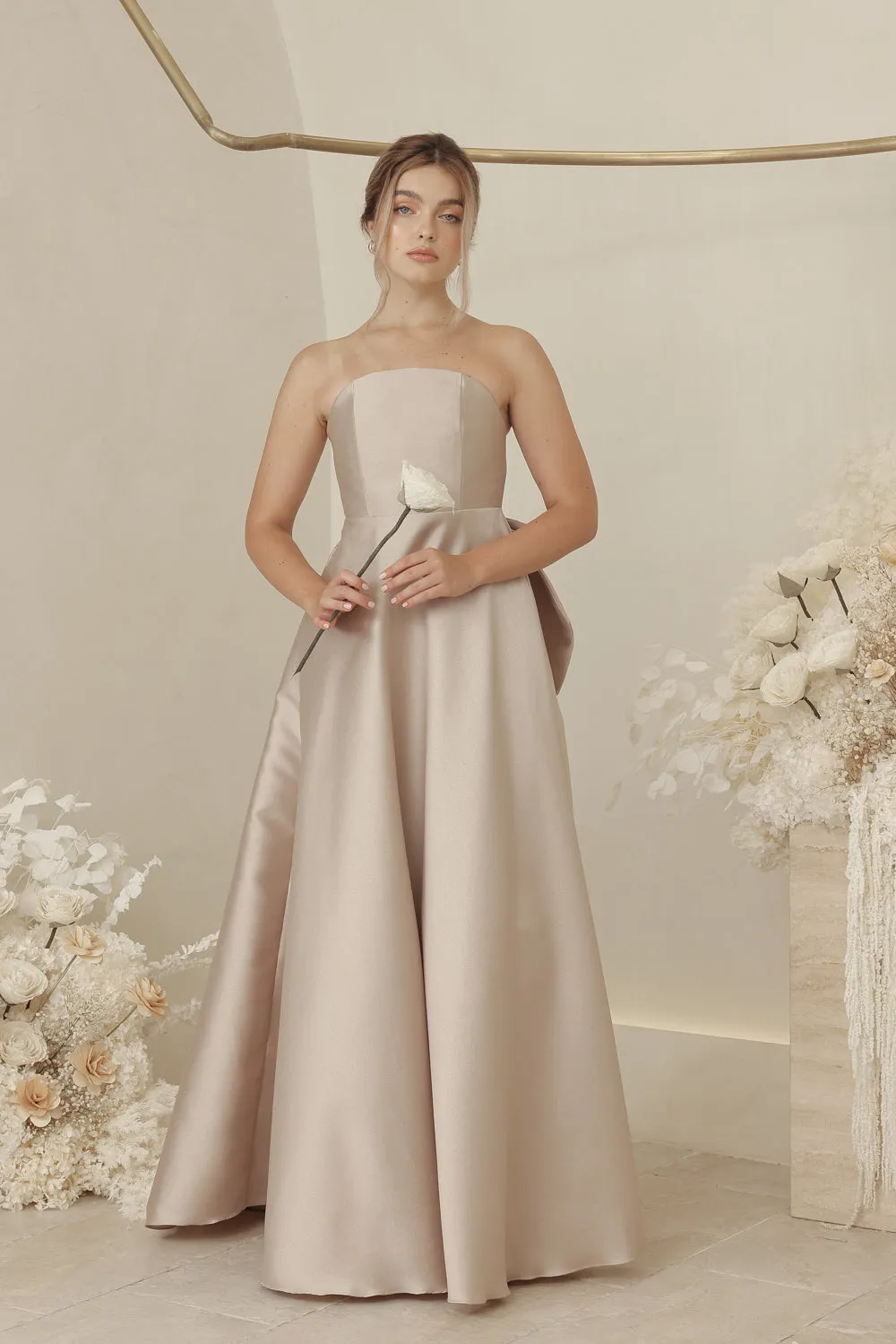 CAROLINE Strapless Curved Neckline Full Length Gown with Bow, Pockets and Covered Buttons (Tan Gazaar)
